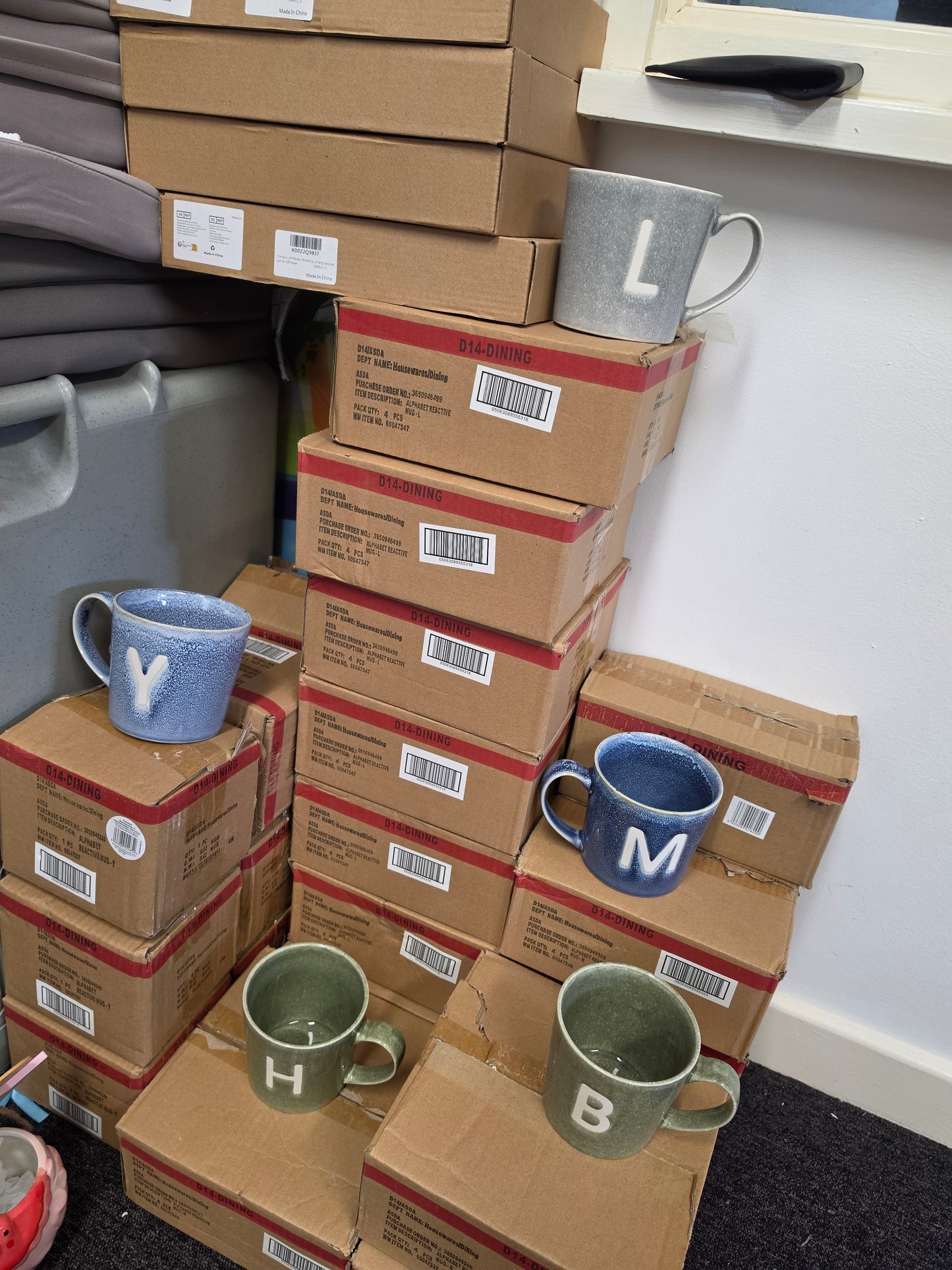 4 mugs with single Letter